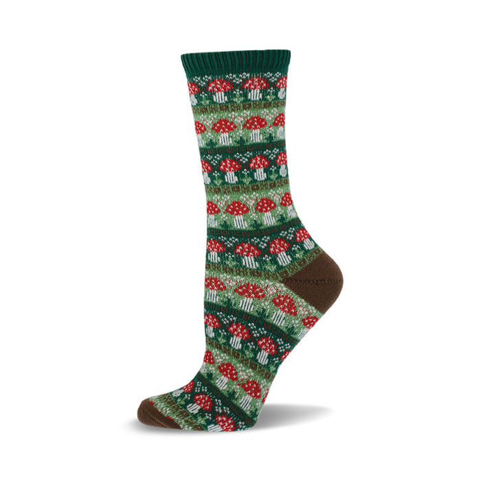 Close-up of a crew sock with a repeating pattern of red and white mushrooms on a green background. Brown cuff detail. }}