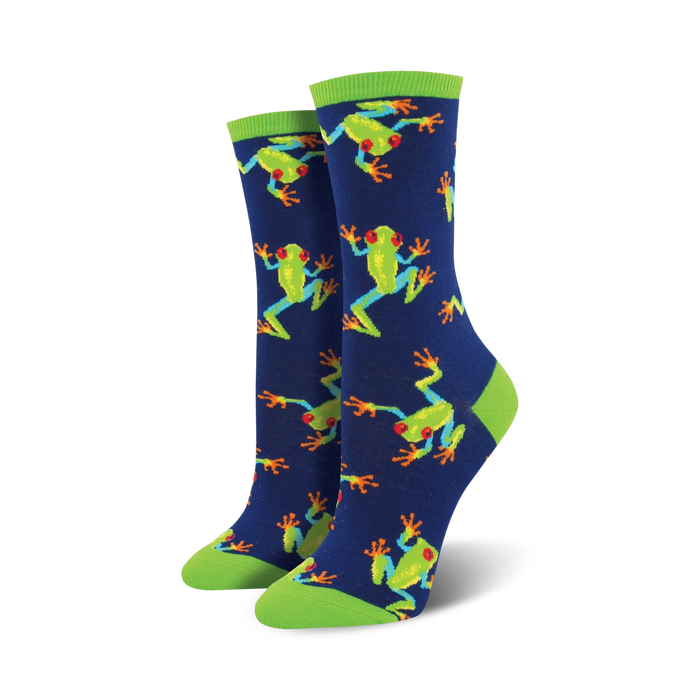A pair of women's crew socks in navy blue, featuring a repeating pattern of bright green tree frogs with orange accents and red eyes.  Lime green cuffs. }}