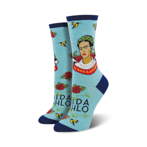 A pair of light blue 'Viva La Frida' socks on a white background. Same design as the cream socks, but in a different color scheme.