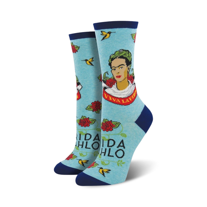 A pair of light blue 'Viva La Frida' socks on a white background. Same design as the cream socks, but in a different color scheme.