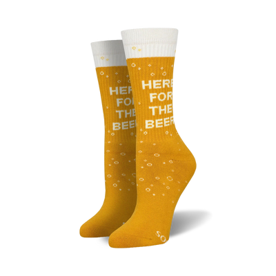 Pair of gold crew socks with a white beer mug graphic and 'Here For The Beer' text.