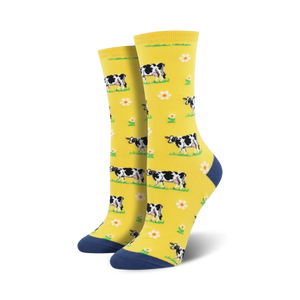 yellow crew socks with allover black and white cow pattern, white flowers with yellow centers.   
