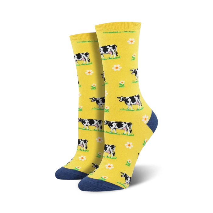 Lifestyle shot showing the yellow cow socks on a person's feet