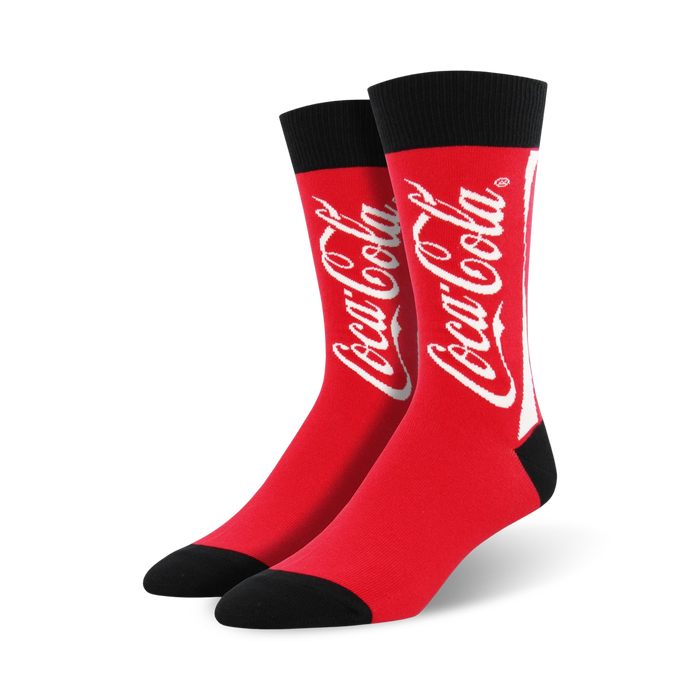 coca-cola socks in crew length, made for men with red color and a black toe/heel. the word coca-cola is splashed across the front in white. }}