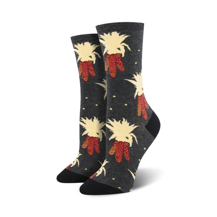 gray crew socks featuring a dark gray background with a pattern of red and yellow corn.   