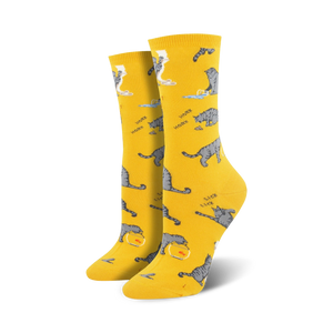 Pair of crew socks in yellow and light blue; featuring grey cats, fish bowls, and the words