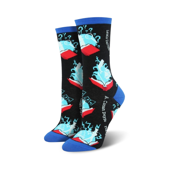 Close-up of a pair of black and blue 'Book Your Adventure' crew socks. The socks feature a design of a book with magical elements.