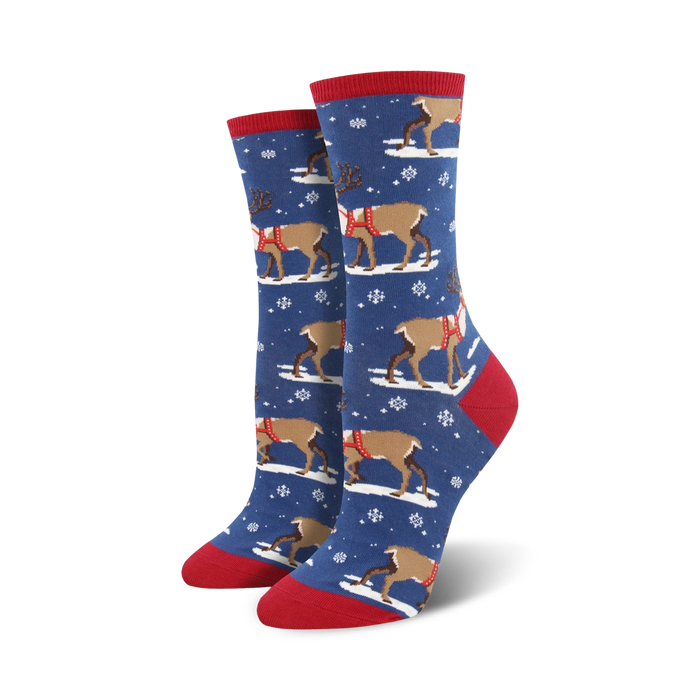 blue reindeer socks with snowflakes on a red background, perfect for the holidays. crew length.  