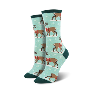 blue crew length womens socks feature a cartoon reindeer design with snowflakes for the christmas season.   