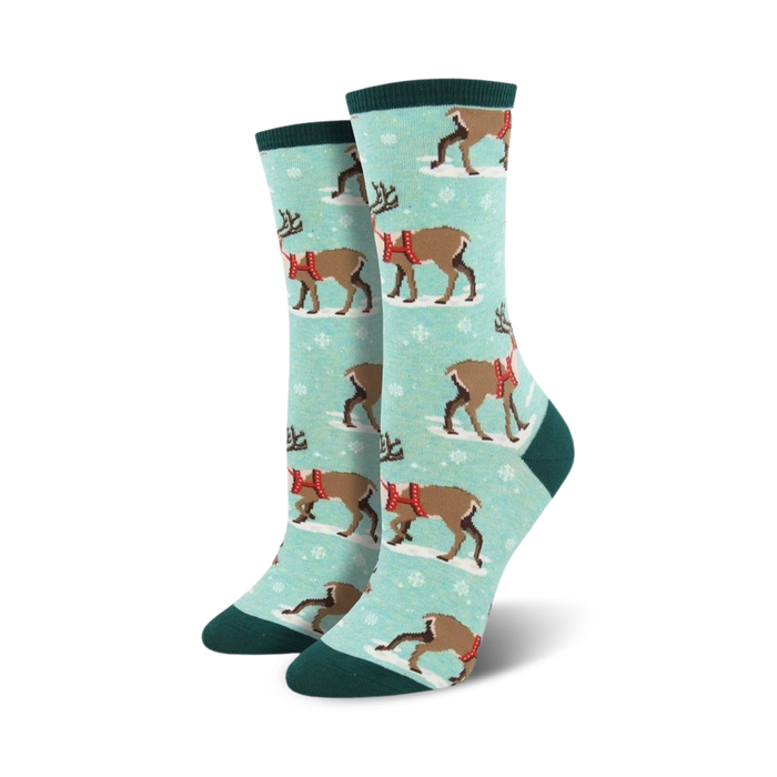 blue crew length womens socks feature a cartoon reindeer design with snowflakes for the christmas season.   