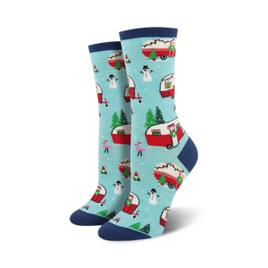 Pair of crew socks in teal and navy blue. Features a pattern of red camper vans decorated for Christmas, snowmen, and pink flamingos.