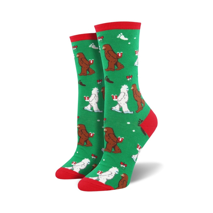 Close-up of a green Mythical Kissmas sock with red cuff, showing the Bigfoot and Yeti design detail.