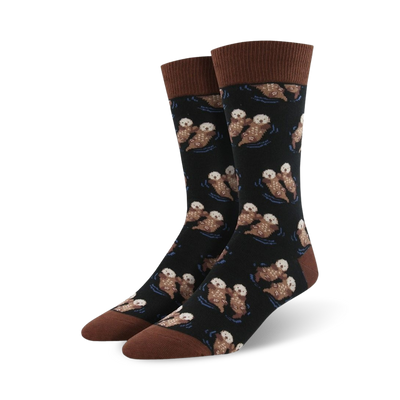 Pair of crew socks; black background with repeating pattern of brown otters swimming; brown cuff.