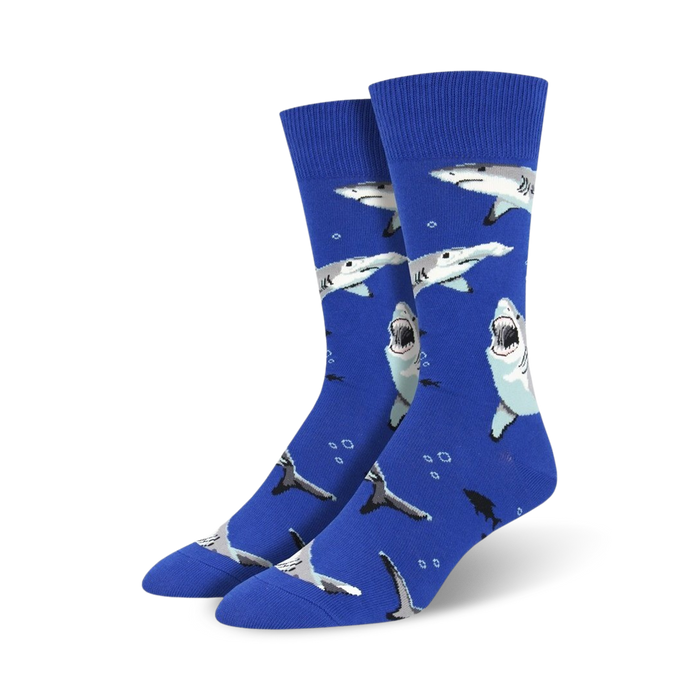 blue crew socks with a pattern of gray and white cartoon sharks and bubbles.   