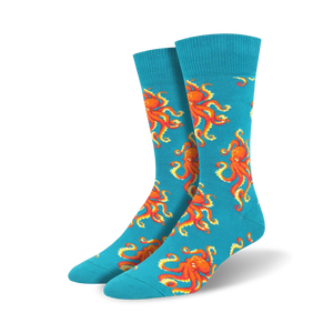  bright turquoise blue crew socks adorned with an all-over pattern of playful orange octopuses.  