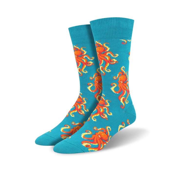 bright turquoise blue crew socks adorned with an all-over pattern of playful orange octopuses.  