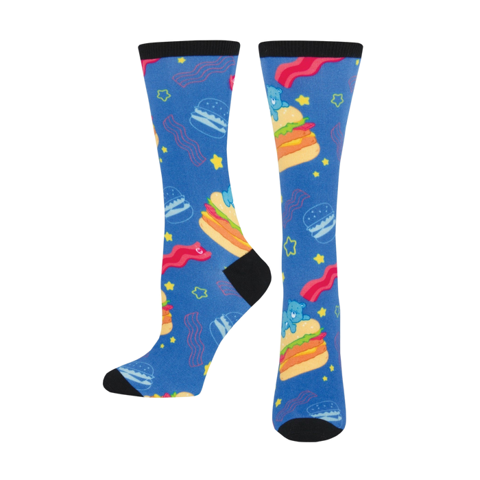 Pair of blue crew socks with burgers, bacon, and Care Bear-like characters. Fun, colorful design. }}