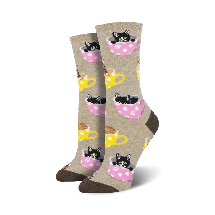 Crew socks in beige, pink & teal featuring black & brown kittens inside polka-dotted teacups.