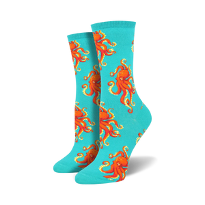 Pair of teal crew socks with a red octopus pattern.