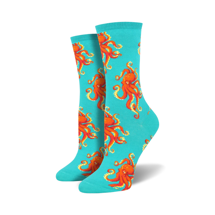 Pair of teal crew socks with a red octopus pattern.