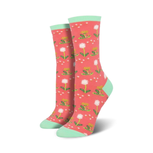 Lifestyle shot showing the coral-colored 'Wishes In The Wind' socks with mint cuffs.
