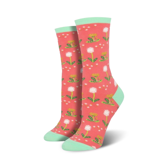Lifestyle shot showing the coral-colored 'Wishes In The Wind' socks with mint cuffs.