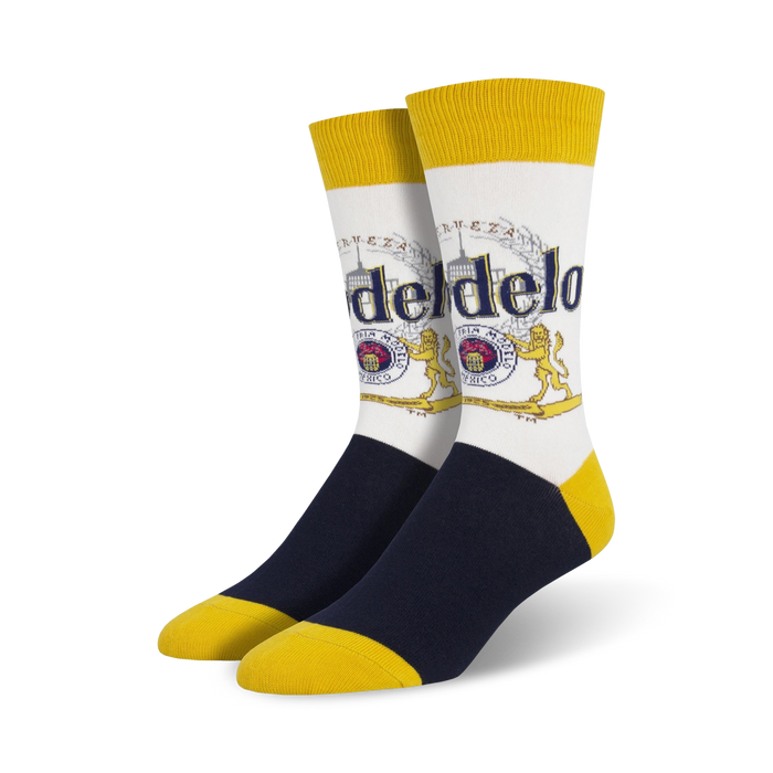 white crew socks with blue toe and heel and yellow top and bottom. pattern of modelo logo with text 