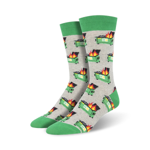 A pair of crew socks with a grey background and repeating pattern of pixelated green dumpsters engulfed in flames. The socks have a green cuff.