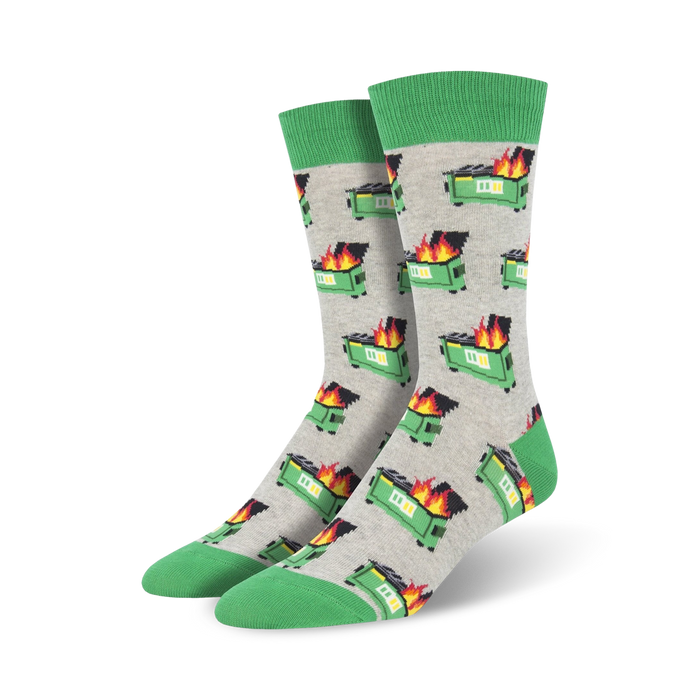 A pair of crew socks with a grey background and repeating pattern of pixelated green dumpsters engulfed in flames. The socks have a green cuff.