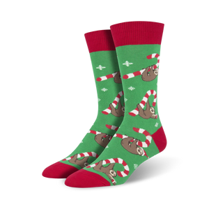 Pair of crew socks; green and red with sloths hanging from candy canes; whimsical Christmas design.