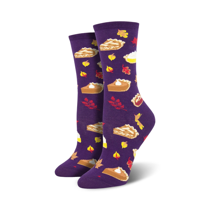 A pair of women's crew socks in purple, adorned with images of autumn pies and leaves. A cozy and festive design perfect for fall. }}