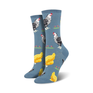 Lifestyle shot of a person's feet wearing the blue chicken socks. They're walking on a light wooden floor.