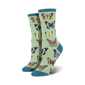 Pair of women's crew socks in sage green with a colorful butterfly pattern.