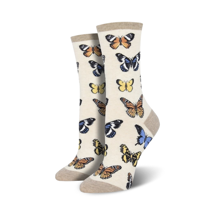 Close-up of women's crew socks in beige featuring a butterfly pattern.