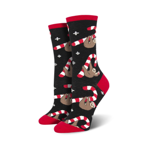 Pair of women's crew socks. Black background with red and white candy canes and brown sloths. Festive and fun!