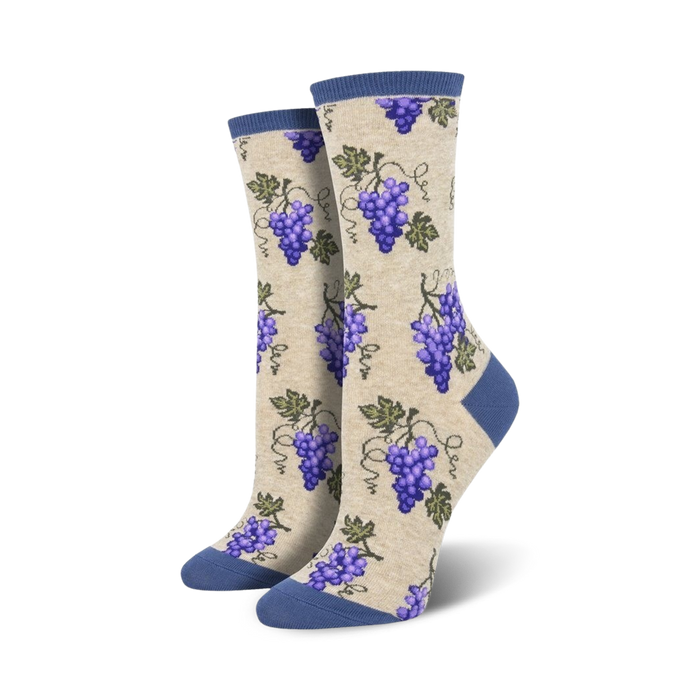 Pair of cream crew socks with purple grapes and vines.  Features a navy blue cuff. }}