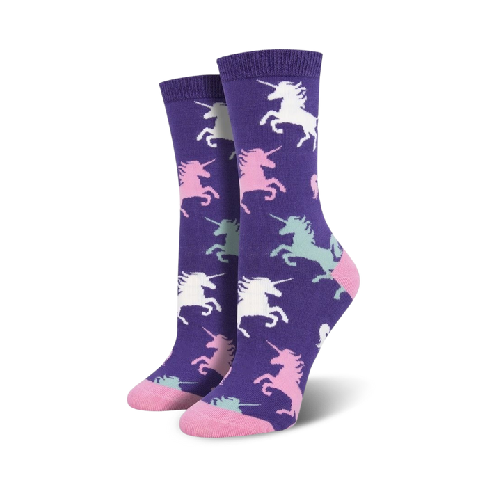 Pair of purple crew socks with a pattern of pastel pink, mint green, and white unicorns. Soft bamboo blend. }}