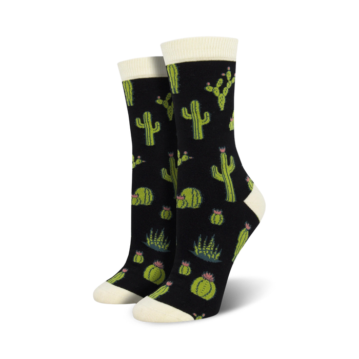 black crew socks with a pattern of cacti and flowers in pink and yellow.    }}