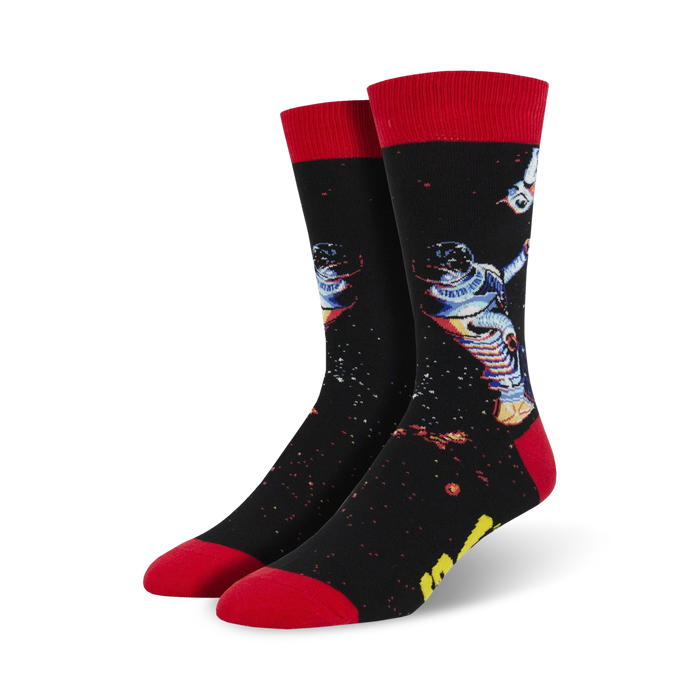 A pair of black crew socks with a retro astronaut design, red cuffs, and a starry night background. Perfect for space explorers and sock fanatics! }}