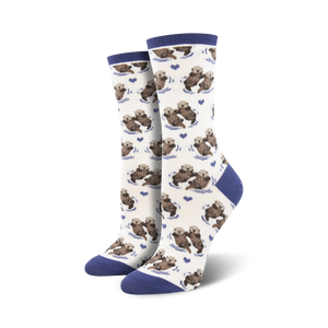 Close-up of a pair of navy-cuffed otter socks against a cream background.
