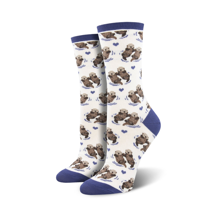 white crew socks for women have otters in the blue-green sea.  