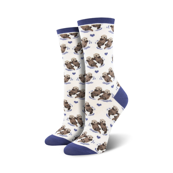 Close-up of a pair of navy-cuffed otter socks against a cream background.