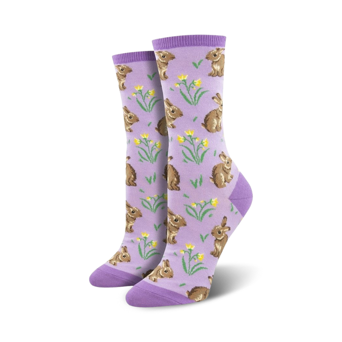 Pair of women's crew socks. Lavender background with repeating pattern of brown bunnies and yellow flowers.