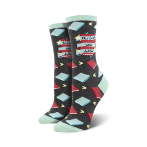Pair of dark gray crew socks with red and teal book illustrations and the phrase 'The Book Was Better'.