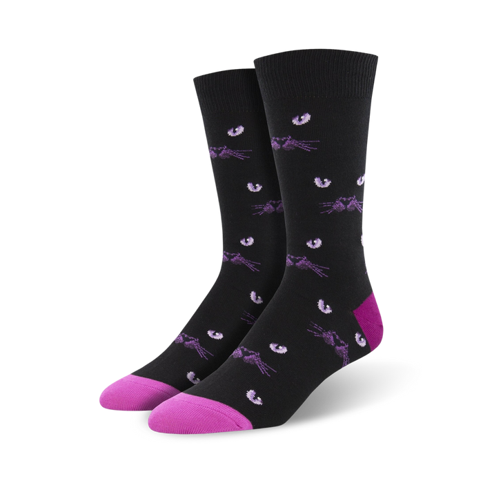 Pair of black crew socks with a repeating pattern of purple cat eyes and whiskers.  Pink accents at the toe and heel. }}