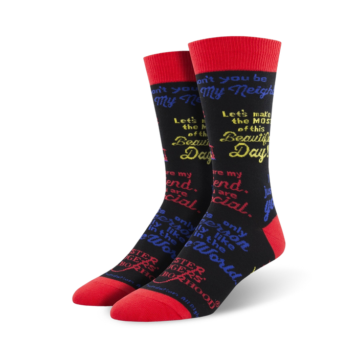 Pair of black crew socks with red cuffs.  Multicolored text features inspirational Mister Rogers quotes. }}