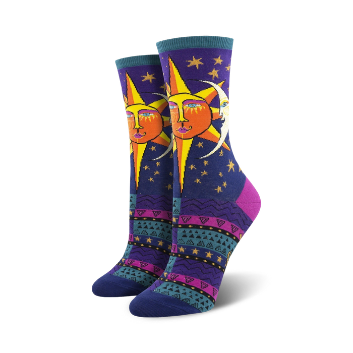 Pair of women's crew socks. Deep purple background with a whimsical sun and moon design. Colorful Southwestern-inspired pattern at the bottom. }}