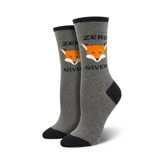 women's crew socks in gray and black have a repeating pattern of an orange fox's face with the words 'zero fox given' underneath.   }}