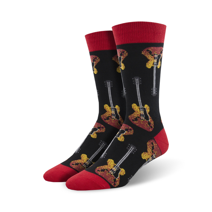 A pair of men's crew socks in black with red cuffs. The socks feature a repeated pattern of yellow and red electric guitars. }}