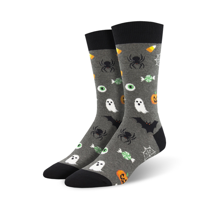 Pair of crew socks, gray with black accents. Feature Halloween designs: ghosts, spiders, bats, candy corn, and eyeballs. }}
